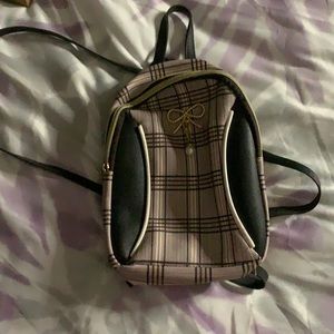 Color 1st bag is gray and black plaid 2nd bag is light pink and black plaid .